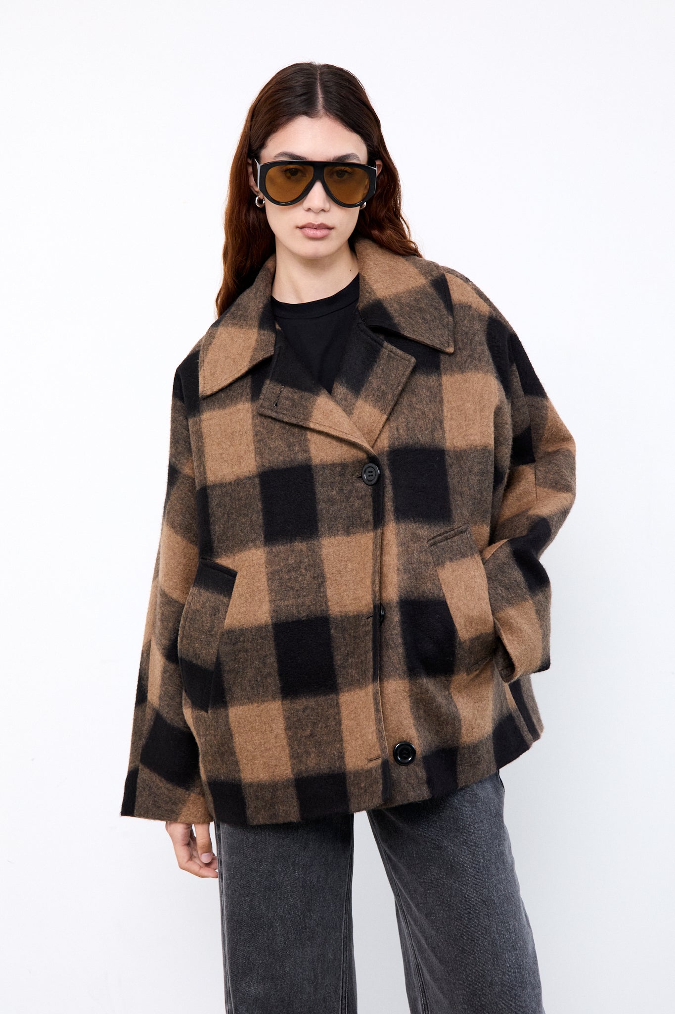Person wearing a checkered coat