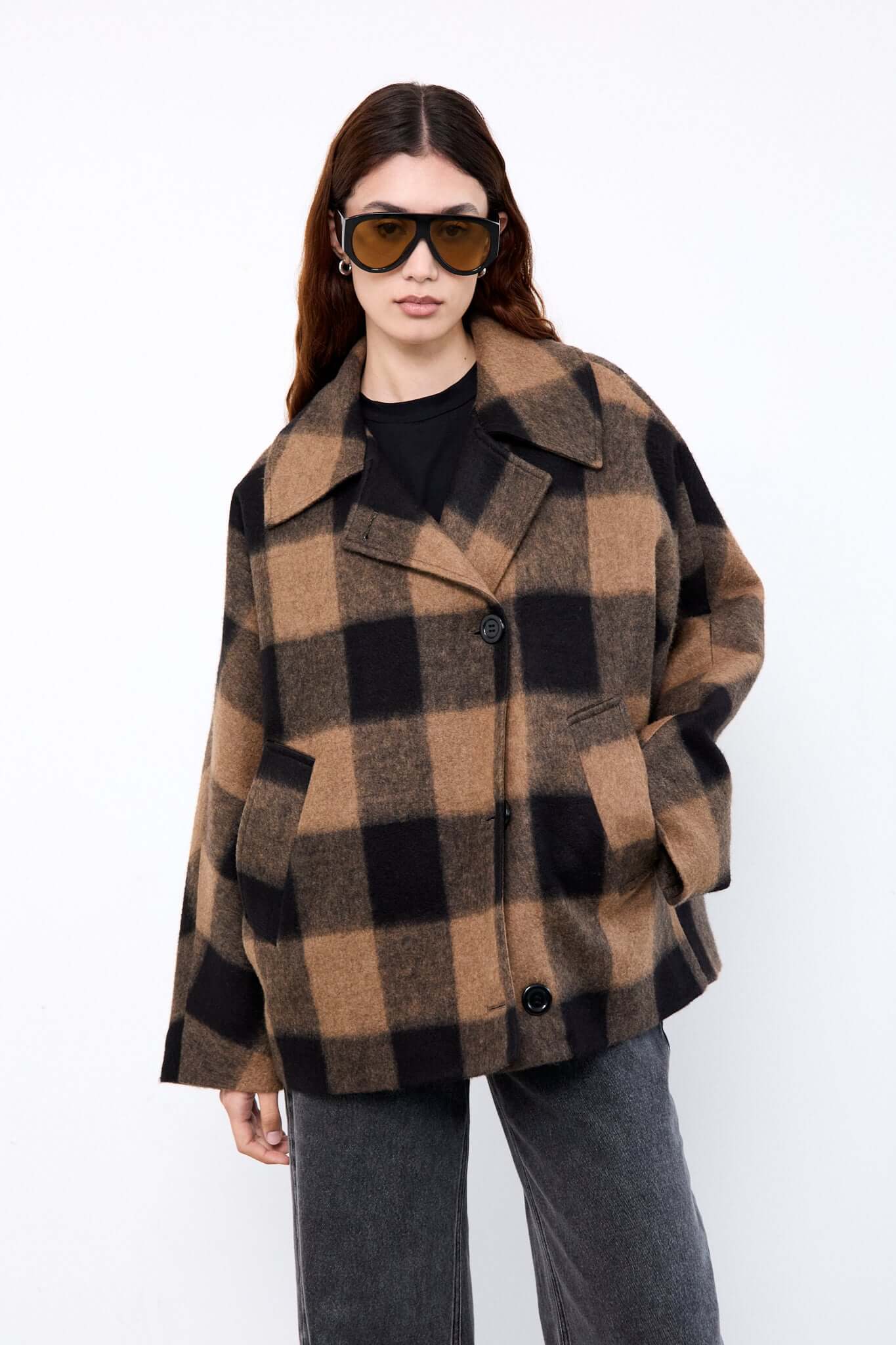 Person wearing a checkered coat