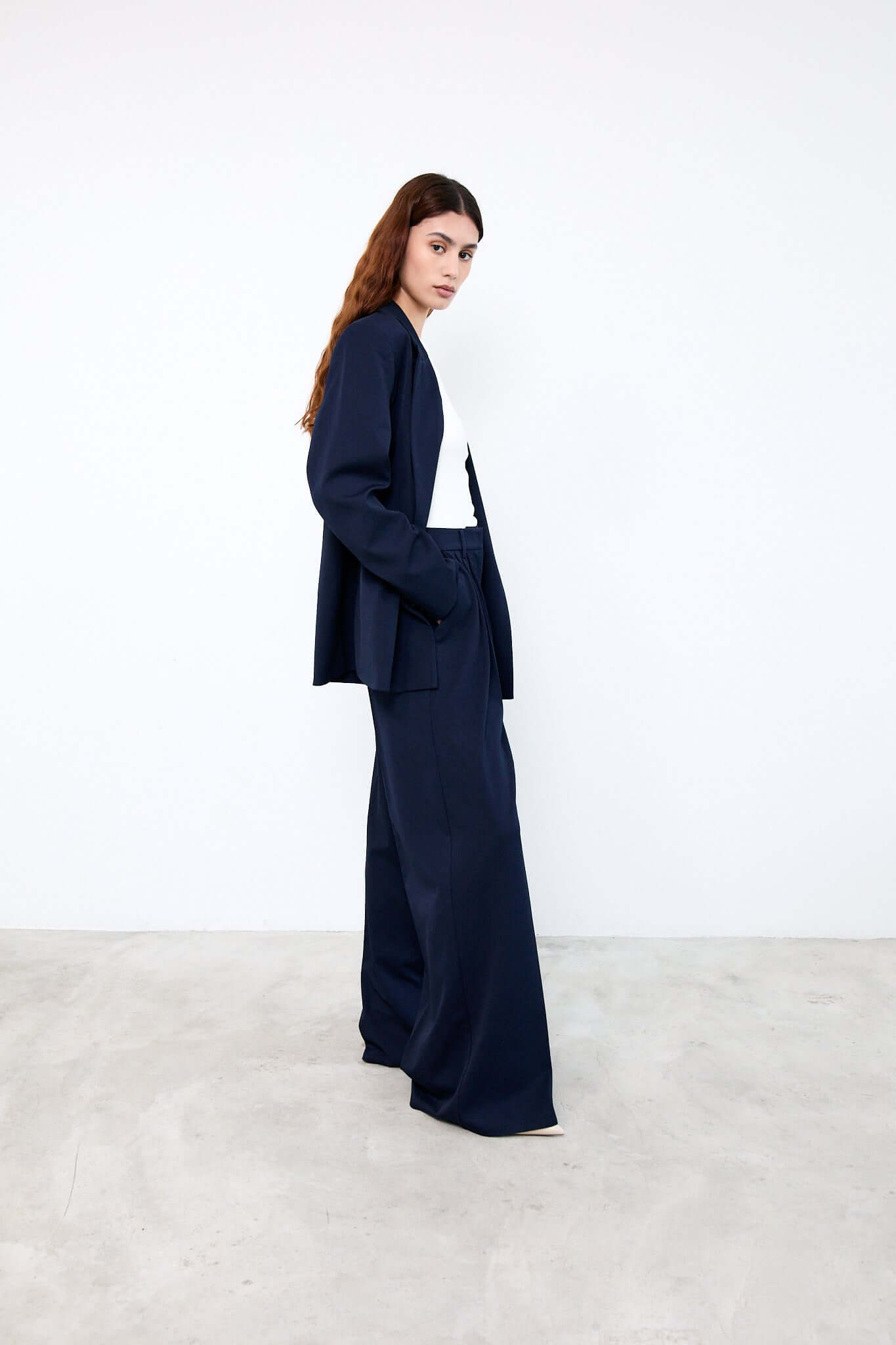 Woman wearing a navy blue suit