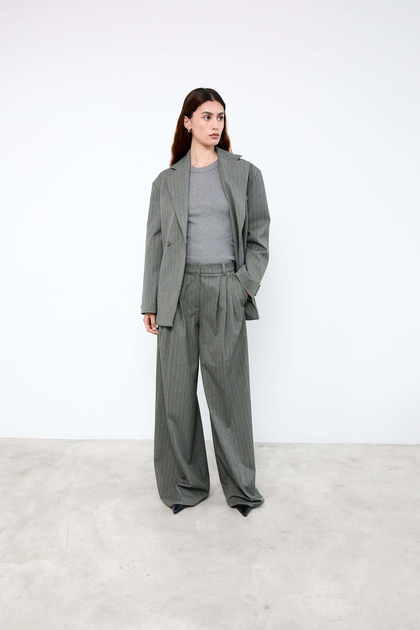 Woman wearing a gray suit