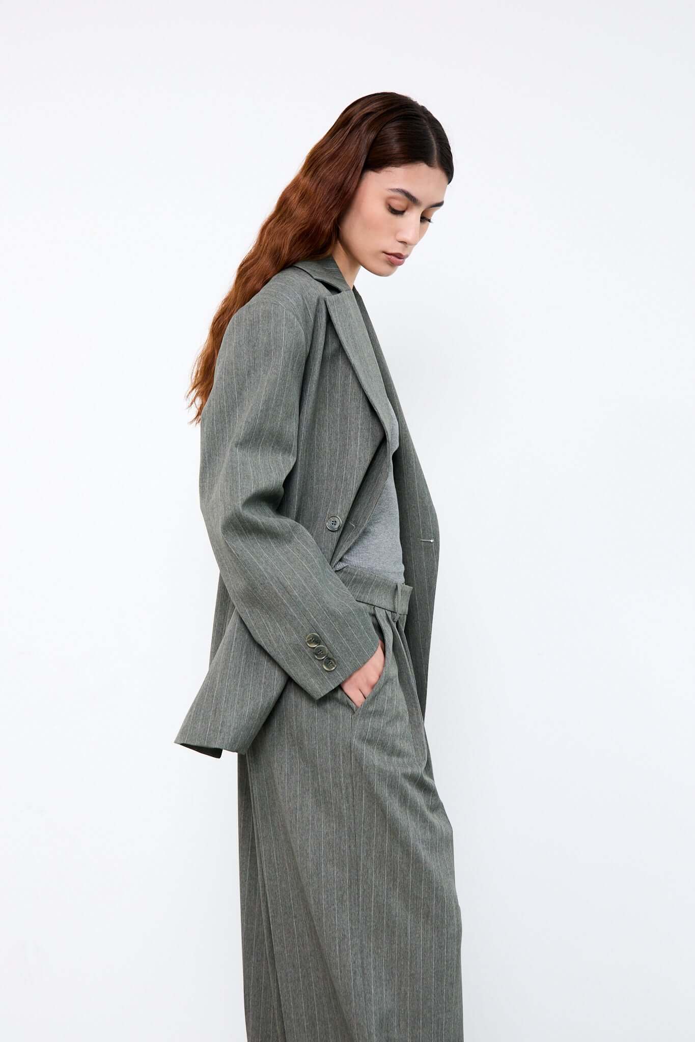 Woman wearing a gray suit