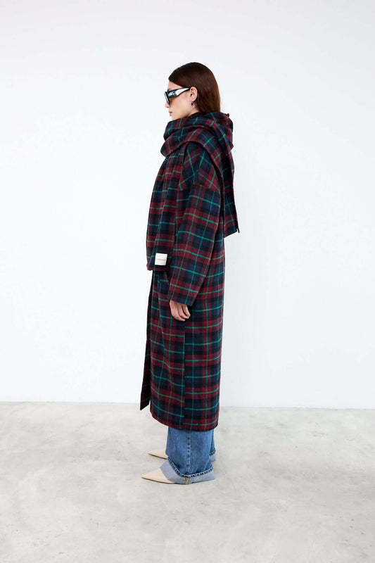Person wearing a long plaid coat