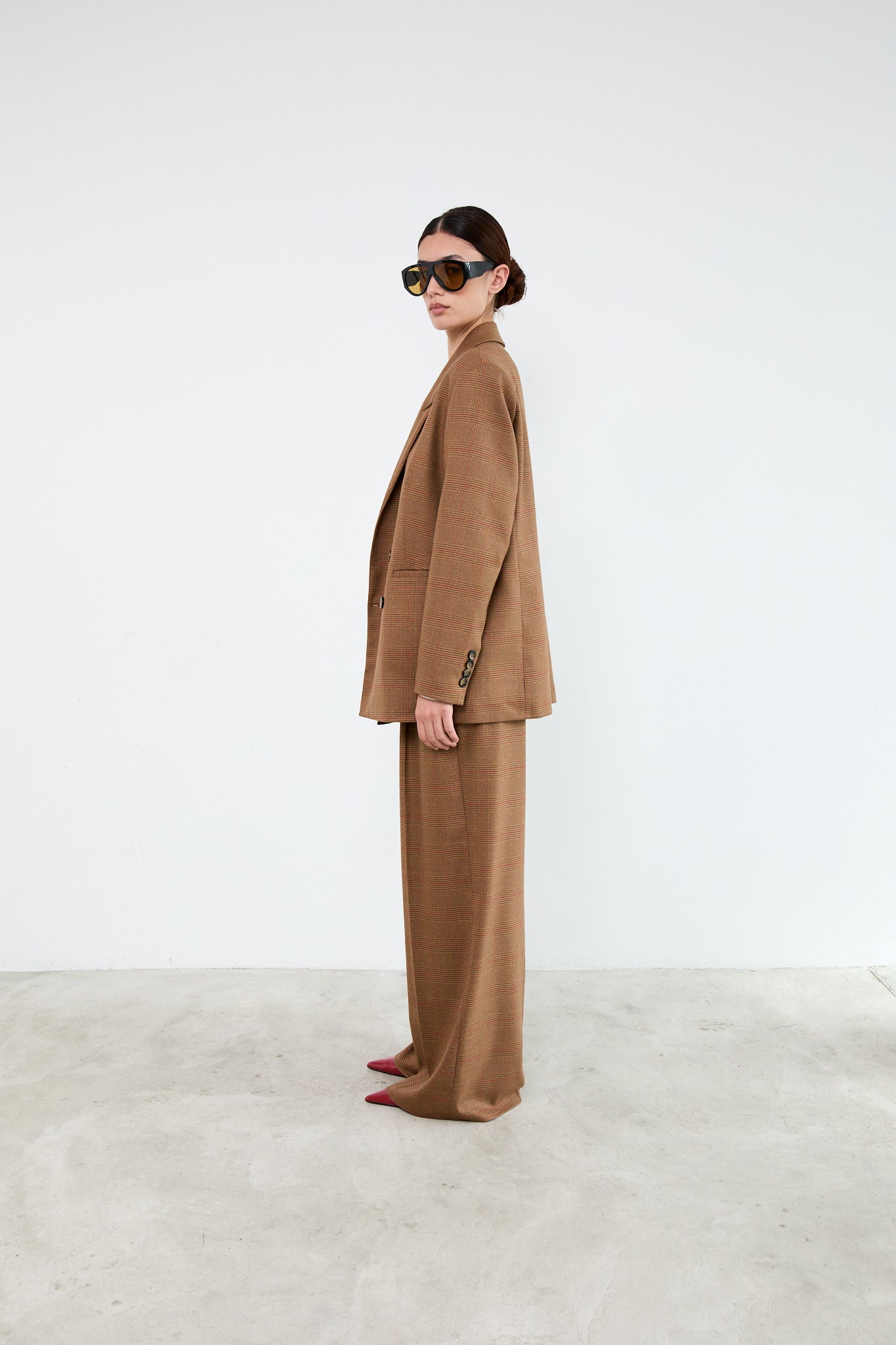 Person wearing a brown suit