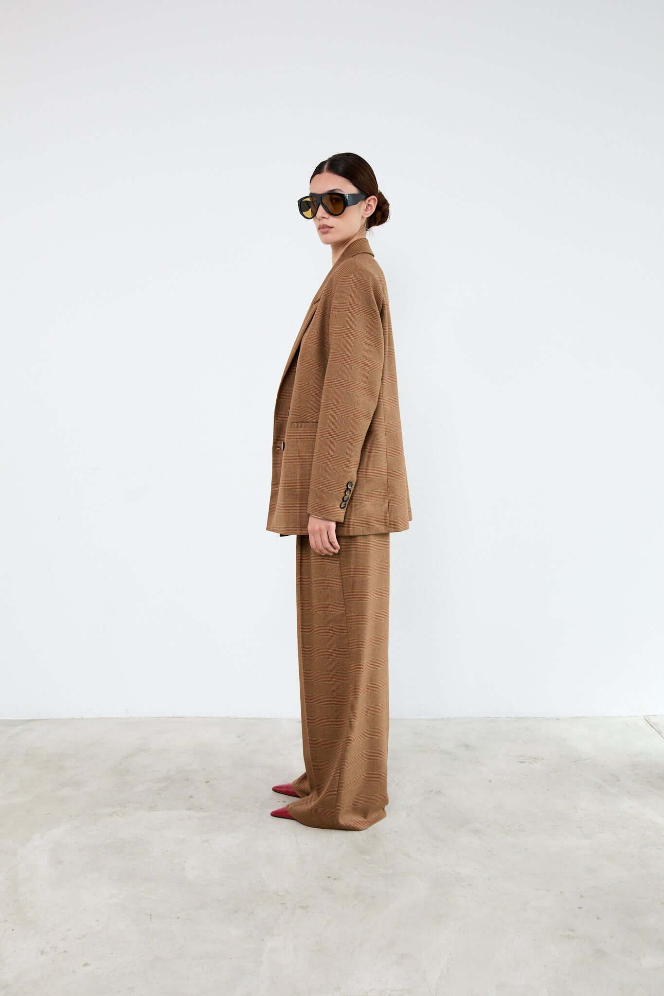 Person wearing a brown suit
