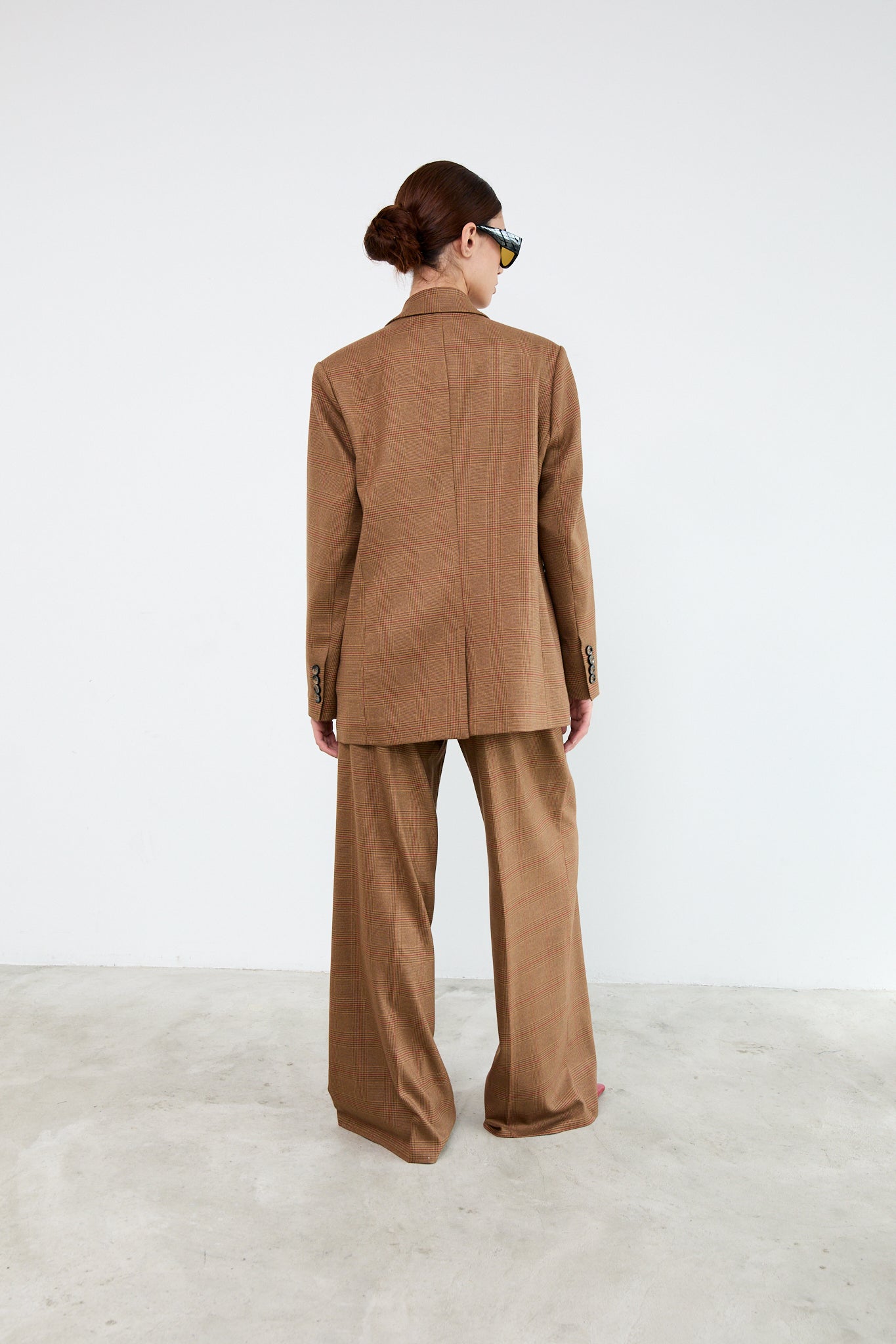 Person wearing a brown suit