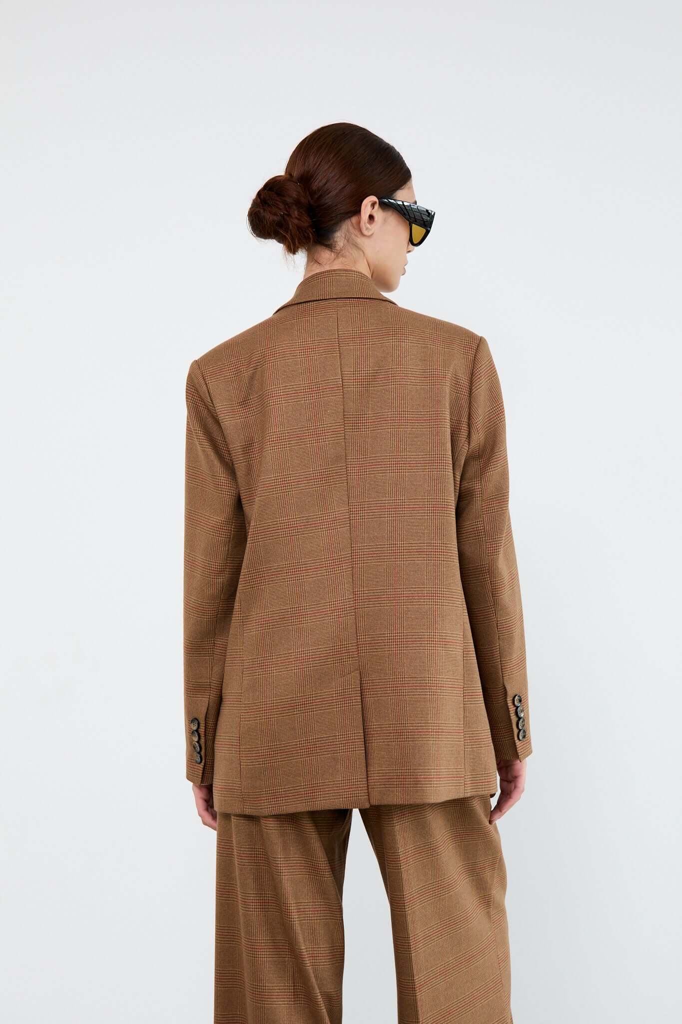 Person wearing a brown suit
