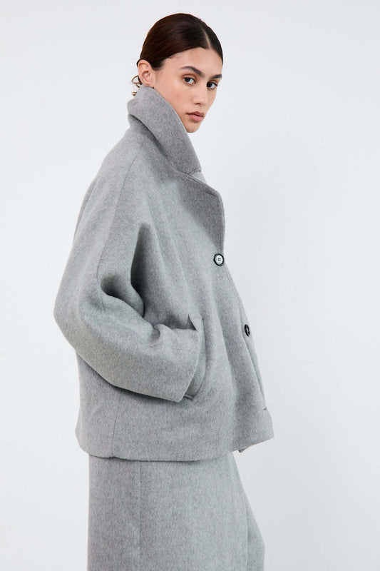 Woman wearing a gray coat