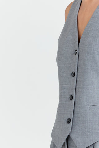 Gray suit jacket with buttons on a light gray background