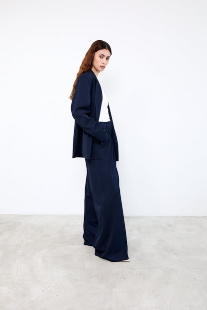 Woman wearing a navy blue suit
