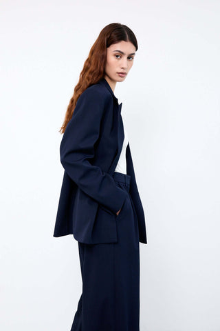 Woman wearing a navy blue suit