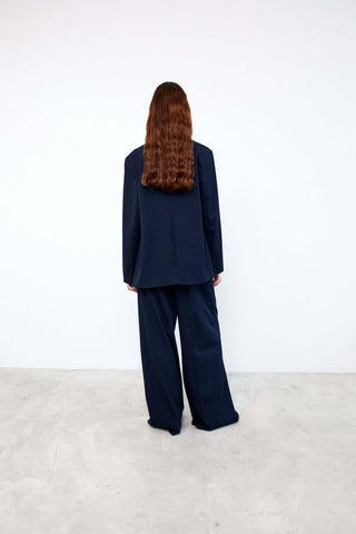 Person wearing a navy blue suit