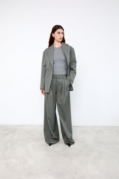 Woman wearing a gray suit 