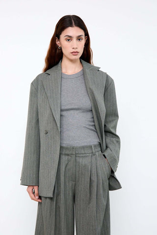 Woman wearing a gray suit 