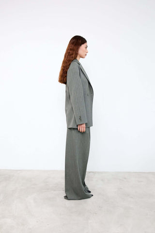 Woman wearing a gray suit