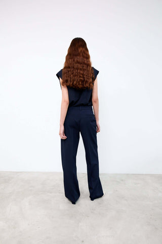 Person wearing a navy blue outfit 