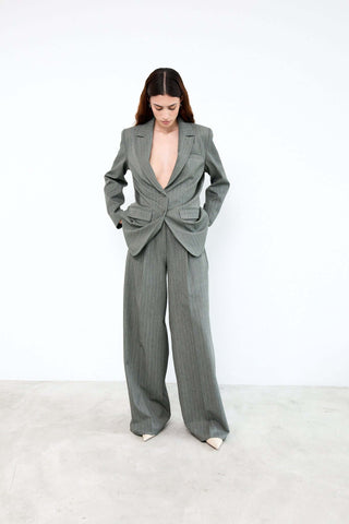 Woman wearing a gray suit