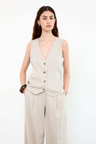 Woman wearing a beige pinstripe