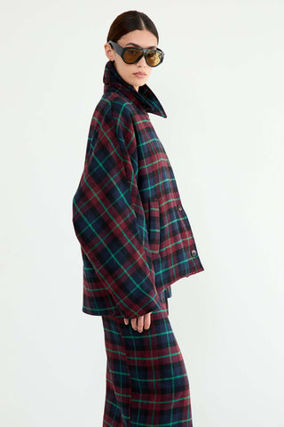 Person wearing a plaid coat and pants