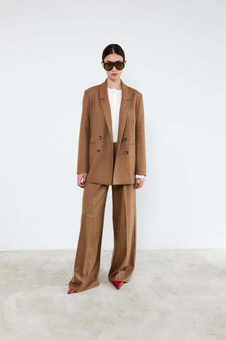 Woman wearing a brown suit 