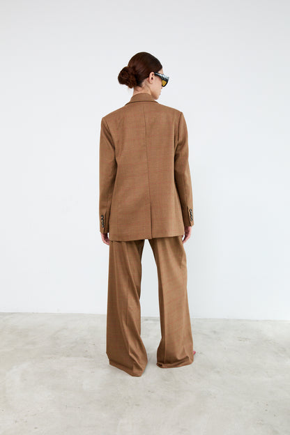 Person wearing a brown suit 