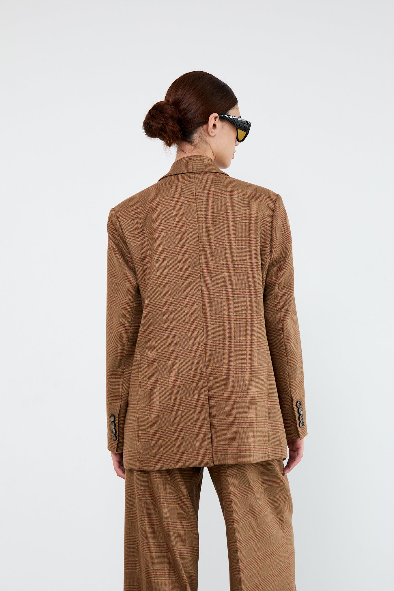 Person wearing a brown suit 