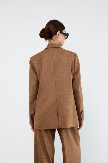 Person wearing a brown suit 