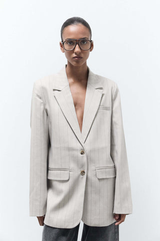 women wearing oversized beige pinstripe blazer 