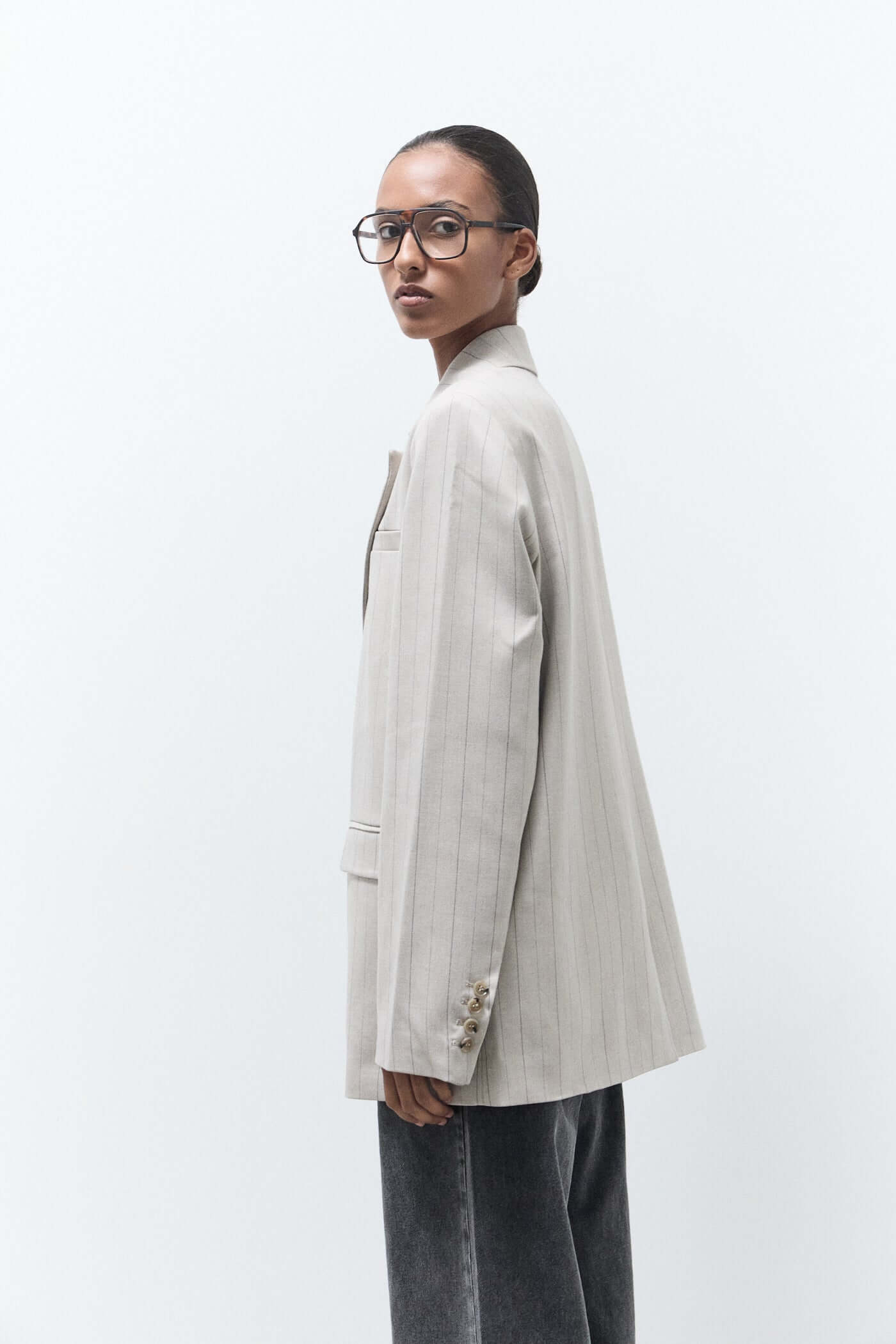 women wearing oversized beige pinstripe blazer 