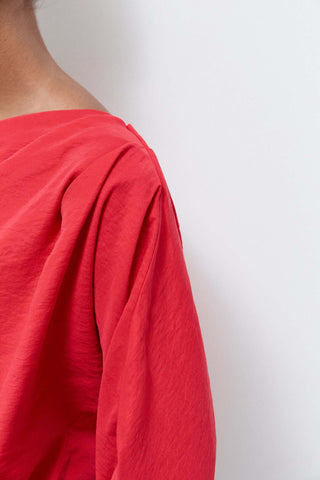 Red garment on a plain background