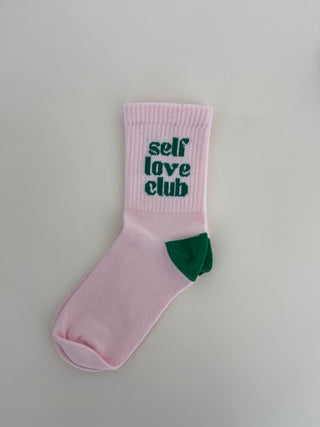 Pink socks with green lettering