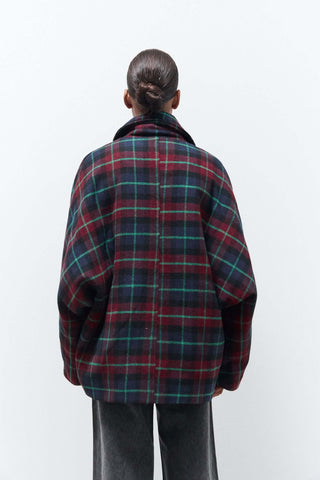 Oversized tartan jacket in red and green checks, back view