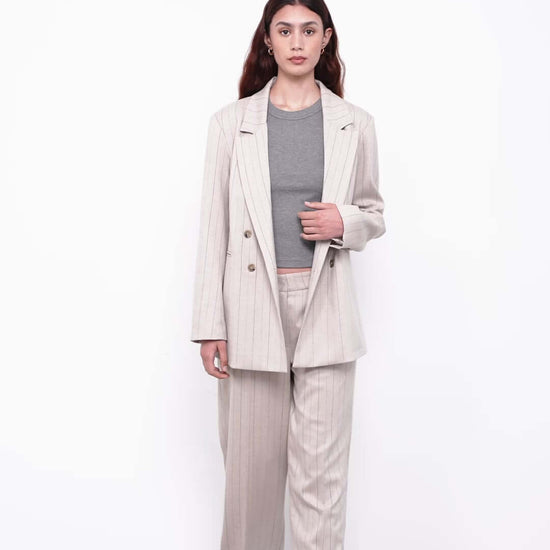 women with bege suit