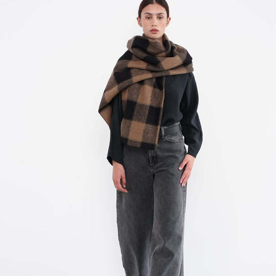 women with scarf in camel and black check