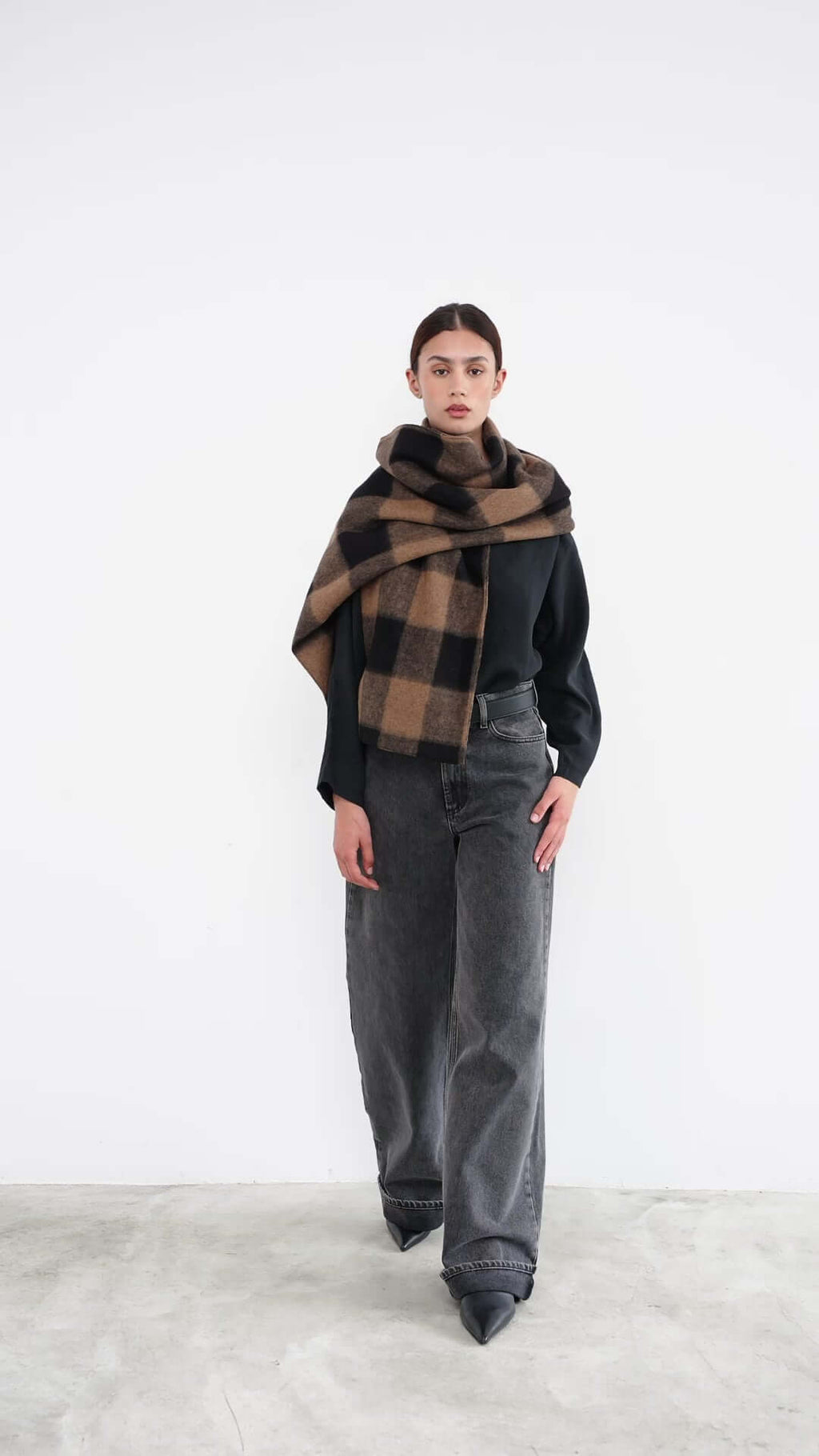 women with scarf in camel and black check