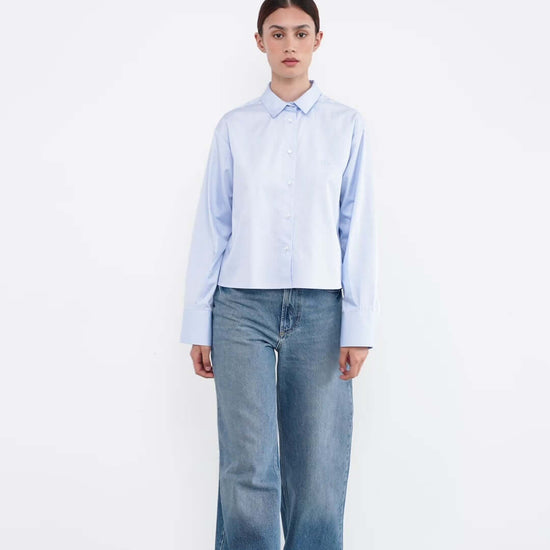 woman in a light blue shirt