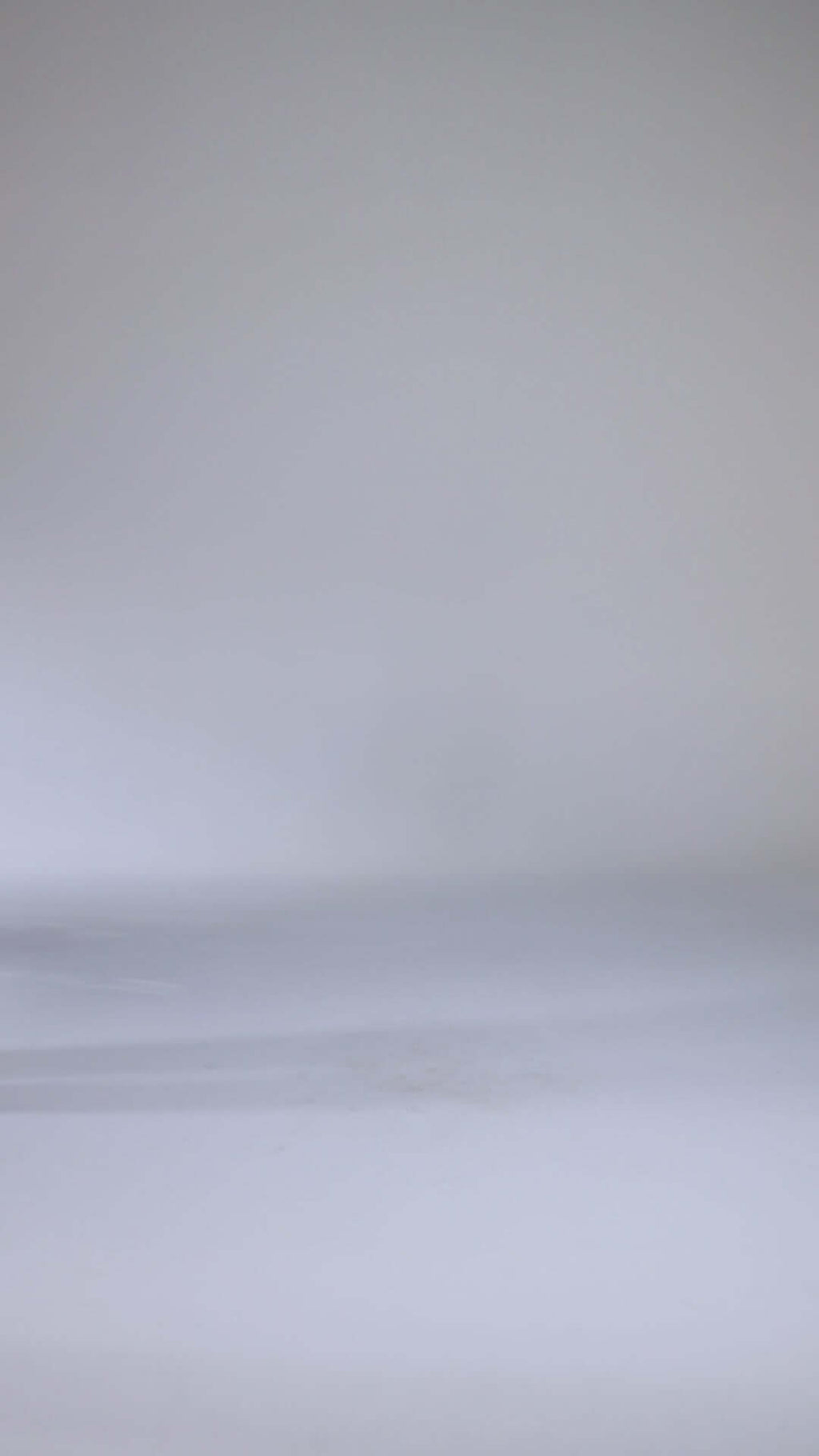 Tailored black suit with relaxed fit and long trousers