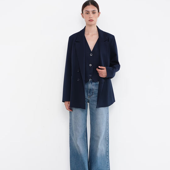 woman with a blue suit jacket