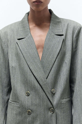 woman in a gray blazer